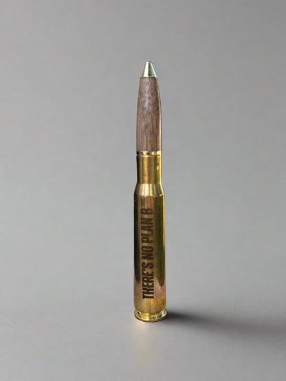 .50 cal brass casing pen standing upright, front view