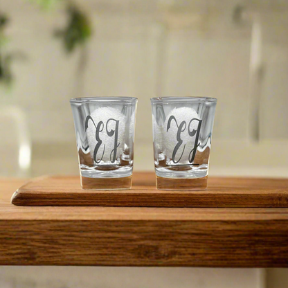 Pair of engraved square shot glasses with a monogram on a wood board — Webb's Engravings, Livonia MI