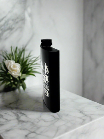 Engraved 8oz stainless steel flask standing on marble countertop — Webb's Engravings