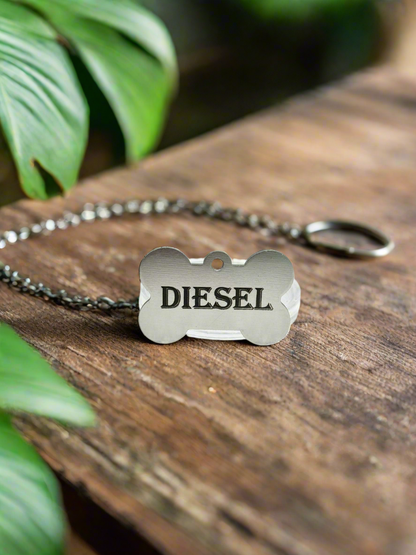 Aluminum dog tag engraved with Diesel on a ball chain
