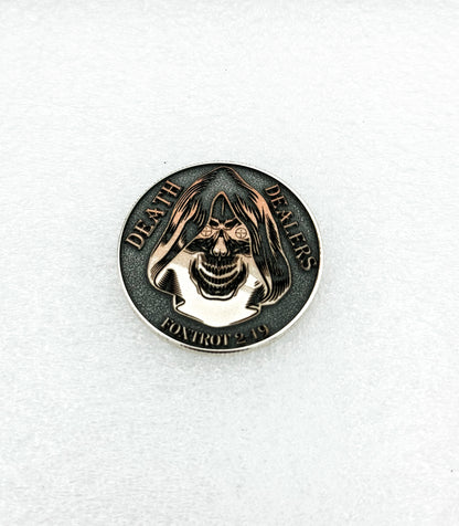 Dark antiqued challenge coin with engraved detail