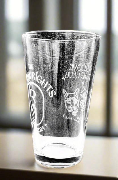 Custom etched pint glass on a bar counter