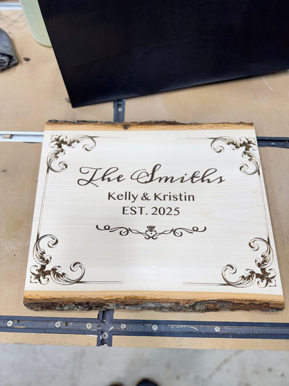 Engraved wood plaque with family name, front view