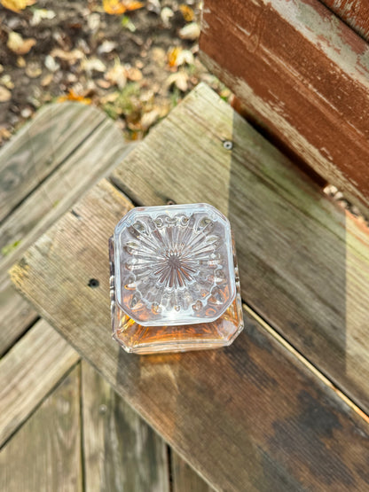 Top view of a square decanter showing the sunburst base pattern