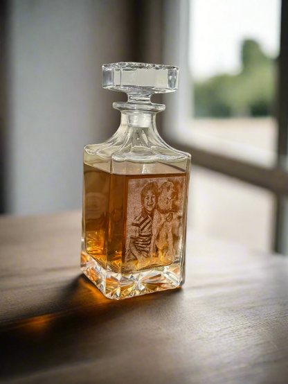 Square glass decanter with portrait engraving in warm window light