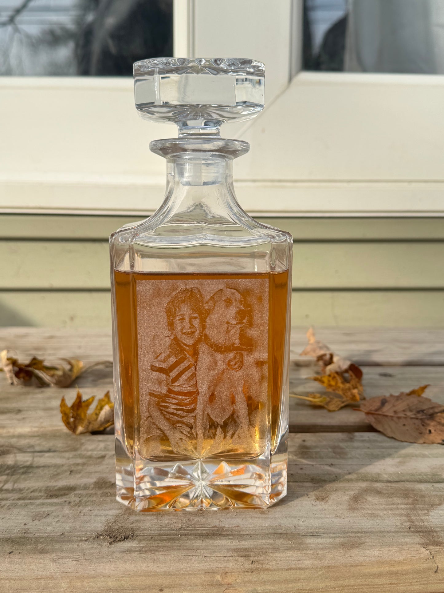 Custom engraved whiskey decanter with a family portrait on a wood bench — Webb's Engravings, Livonia MI
