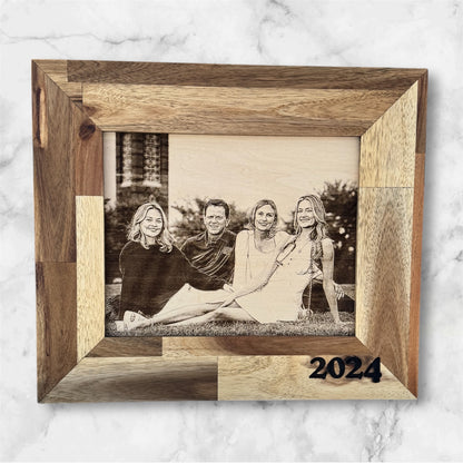 Family photo engraved on wood with 2024 date in a rustic frame
