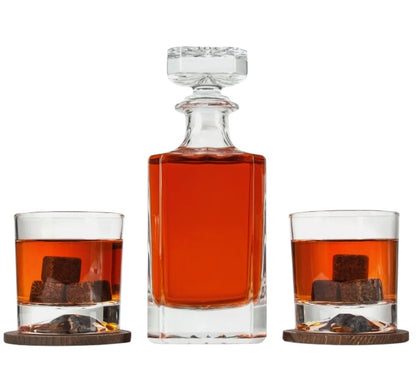Crystal whiskey decanter and two glasses filled, styled shot