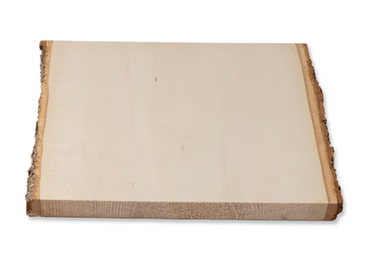 Blank basswood plaque with natural bark edge, top view