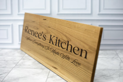 Engraved maple kitchen sign angled to show depth of the laser engraving