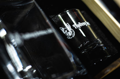 Engraved rocks glass with company logo, low light detail
