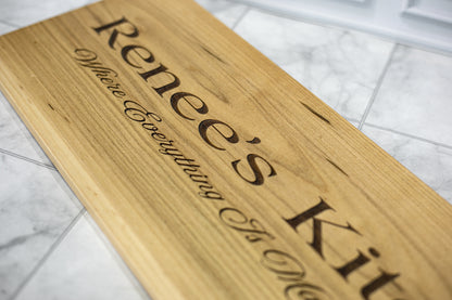 Detail of script engraving on a custom maple kitchen sign