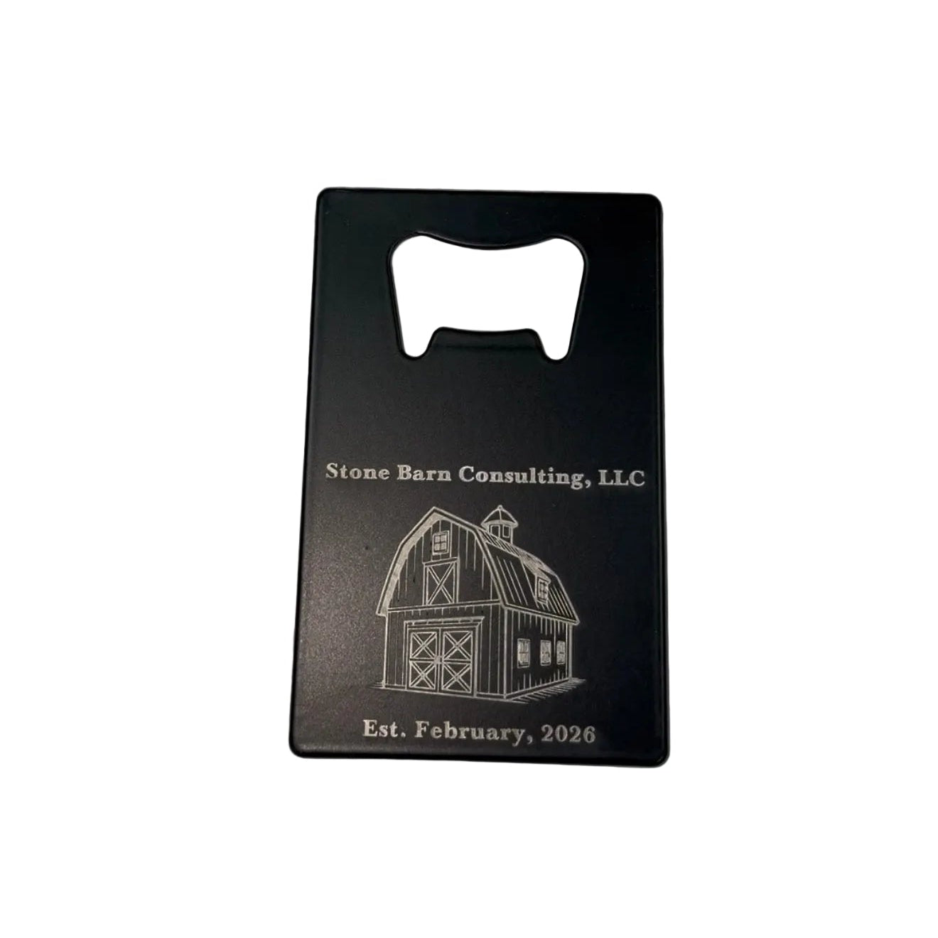Engraved bottle opener with a business name, barn logo, and established date