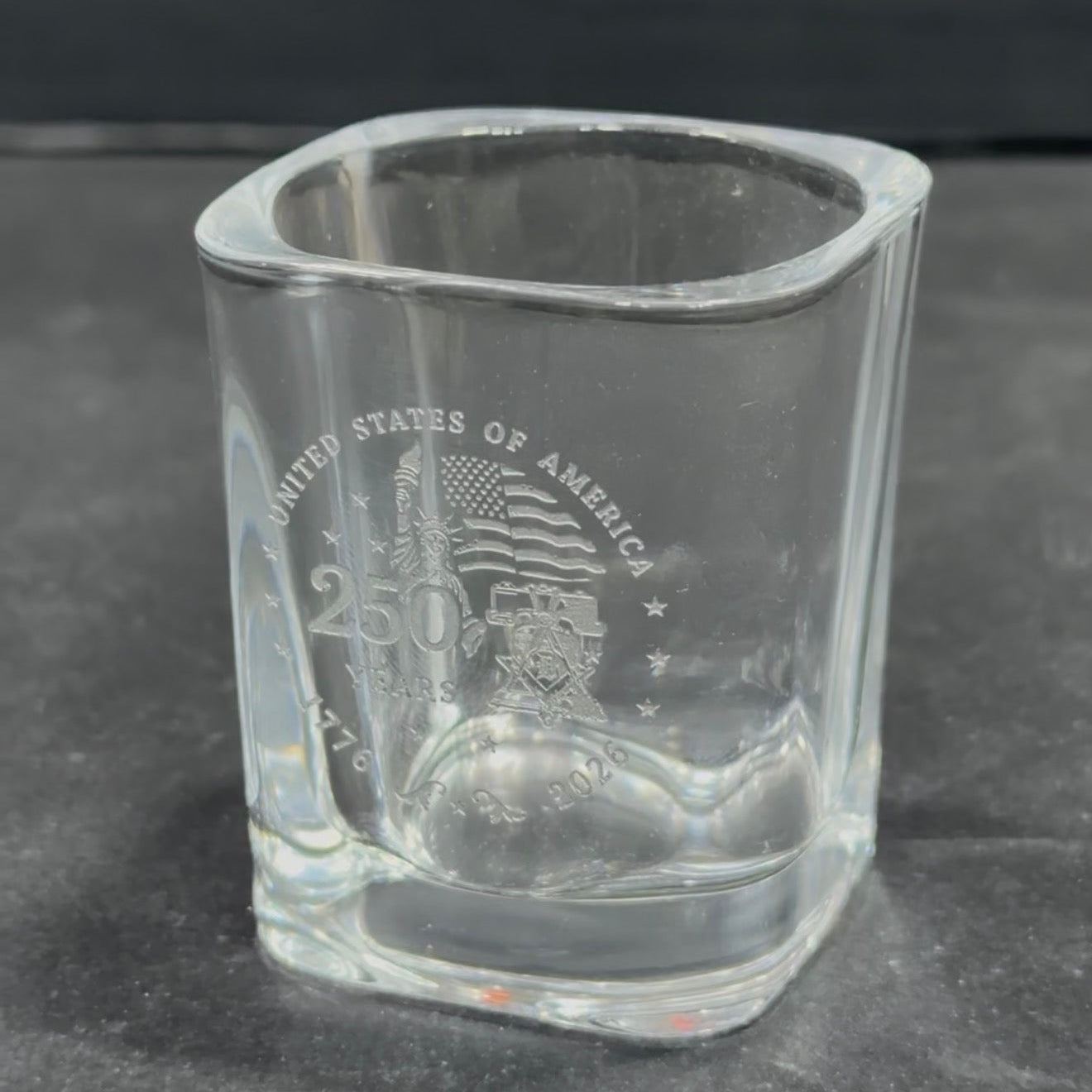 Engraved shot glass with United States anniversary design, side view