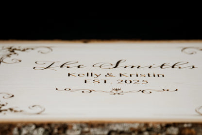 Engraved family name plaque on a dark background