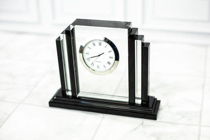 Crystal clock award on a light surface, straight on