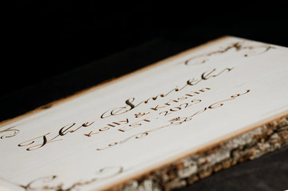 Angled view of an engraved basswood plaque showing thickness