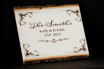 Custom engraved wood plaque angled to show the bark edge