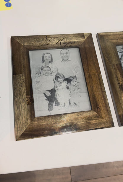 Engraved family photo displayed in a wood frame on a shelf, video